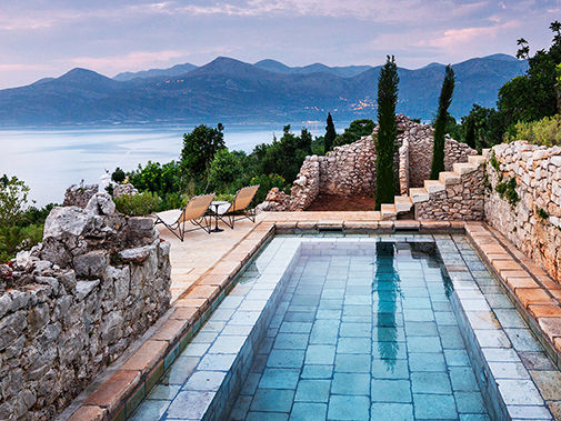 Antique Stone Pool Coping Slabs Milled at 2.5" in Thickness Installed in a pool in Greece
